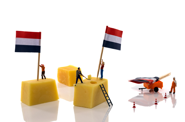 little people putting flags on dutch cheese 03 11 