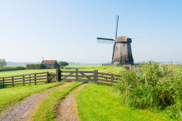 view of an old windmill holland the road leading 0